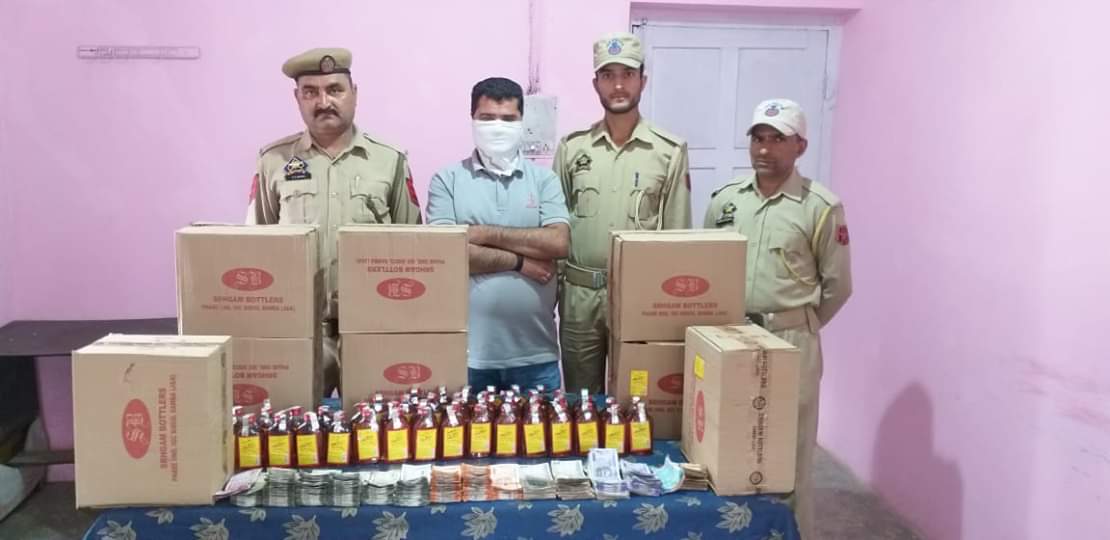 Police arrests Bootlegger with 450 bottles and around four lakh cash 