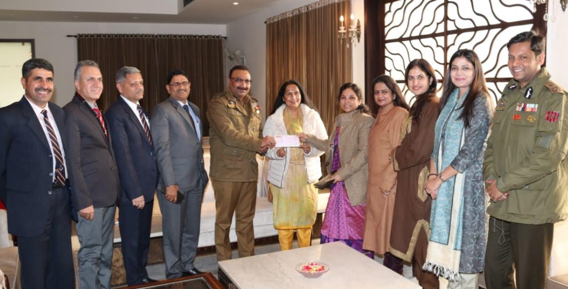 Mrs Sireesha Srinivas presents a Cheque of rupees Six lakh to DGP J&K, for welfare of martyrs families