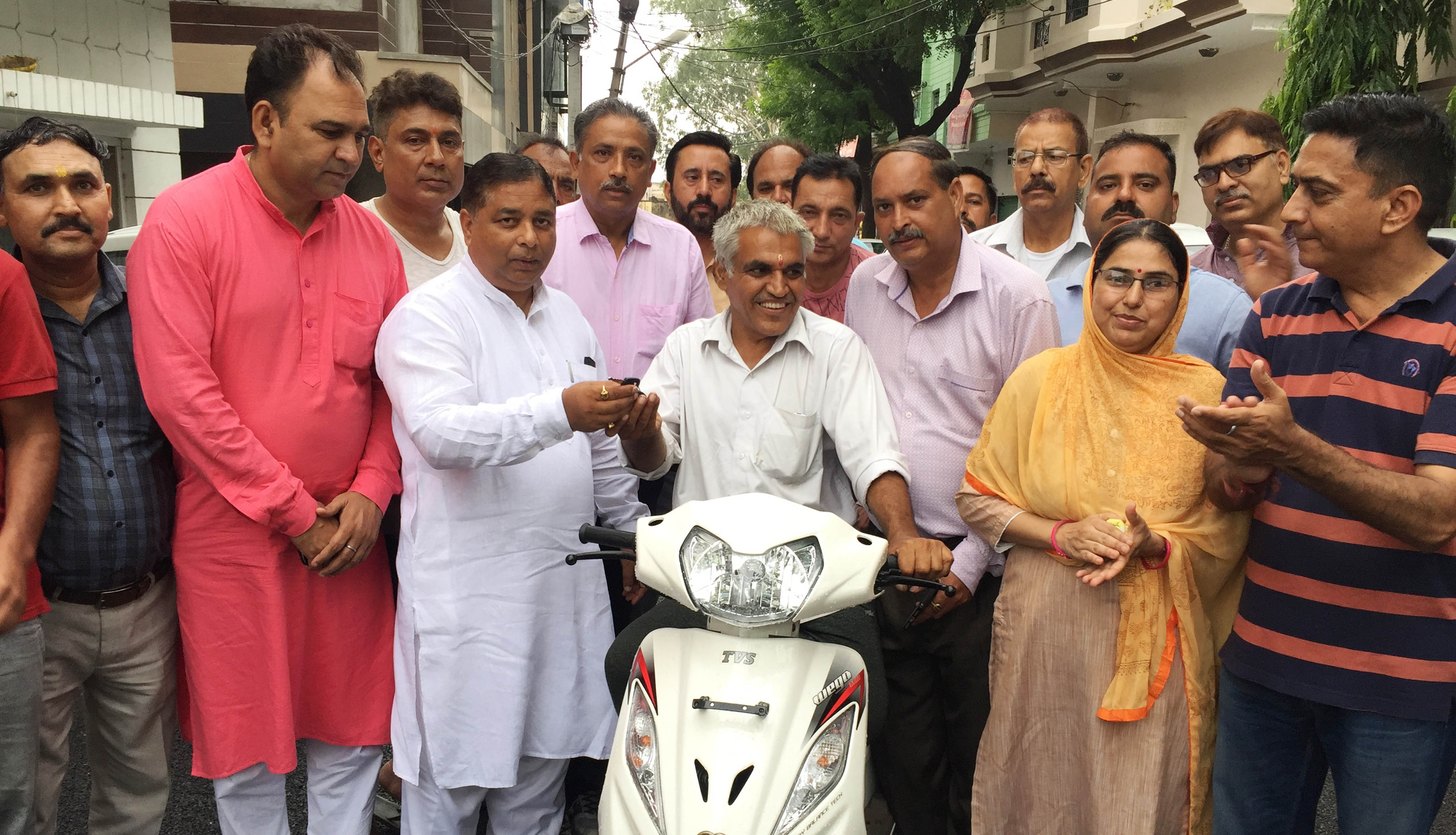 Sat Sharma (CA) hands over  Scooty to differently abled person
