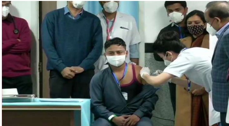 Sanitation worker becomes first person to receive COVID-19 vaccine jab