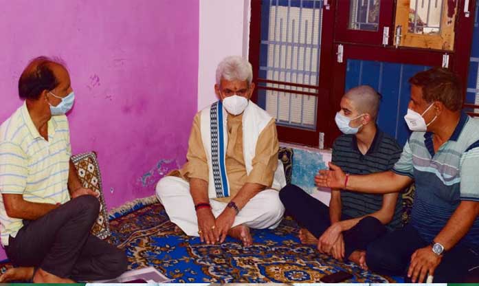 Lt Governor visits family of Councillor Rakesh Pandita, who was shot dead by terrorists