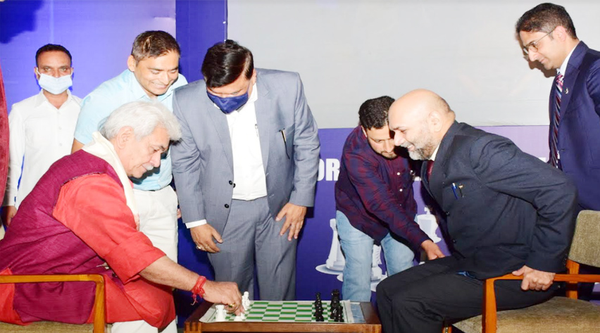 Lt Governor hands over the Chess Olympiad Torch to Chess Grandmaster Pravin Thipsay at SKICC