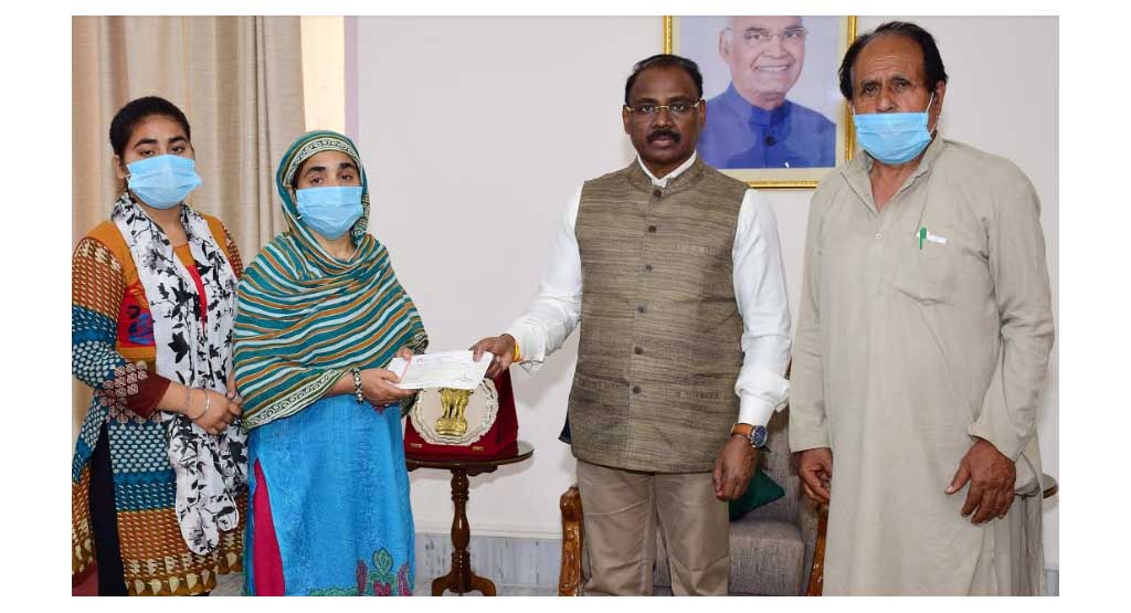Lt Governor hands over ex-gratia relief to NoK’s of Martyr Sarpanch Ajay Pandita