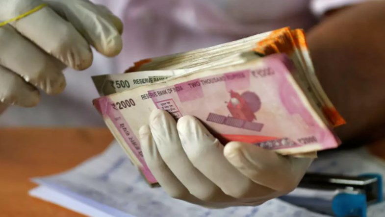 Rupee hits record low; closes 60 paise down at 77.50 against US dollar