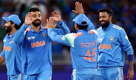 Varun takes five as India top group and set up Australia showdown