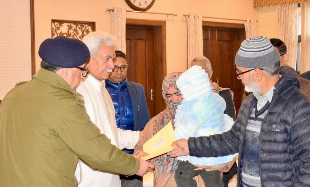 Lieutenant Governor meets the families of Nowgam's accidental blast martyrs and hands over appointment letters on compassionate grounds